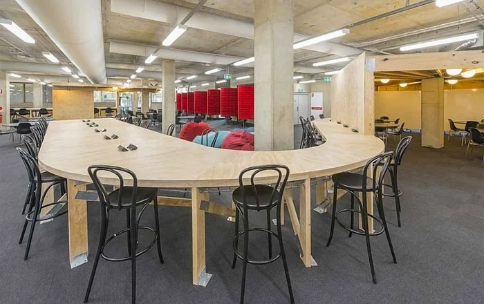 Macquarie University library interior plywood furniture student workspace